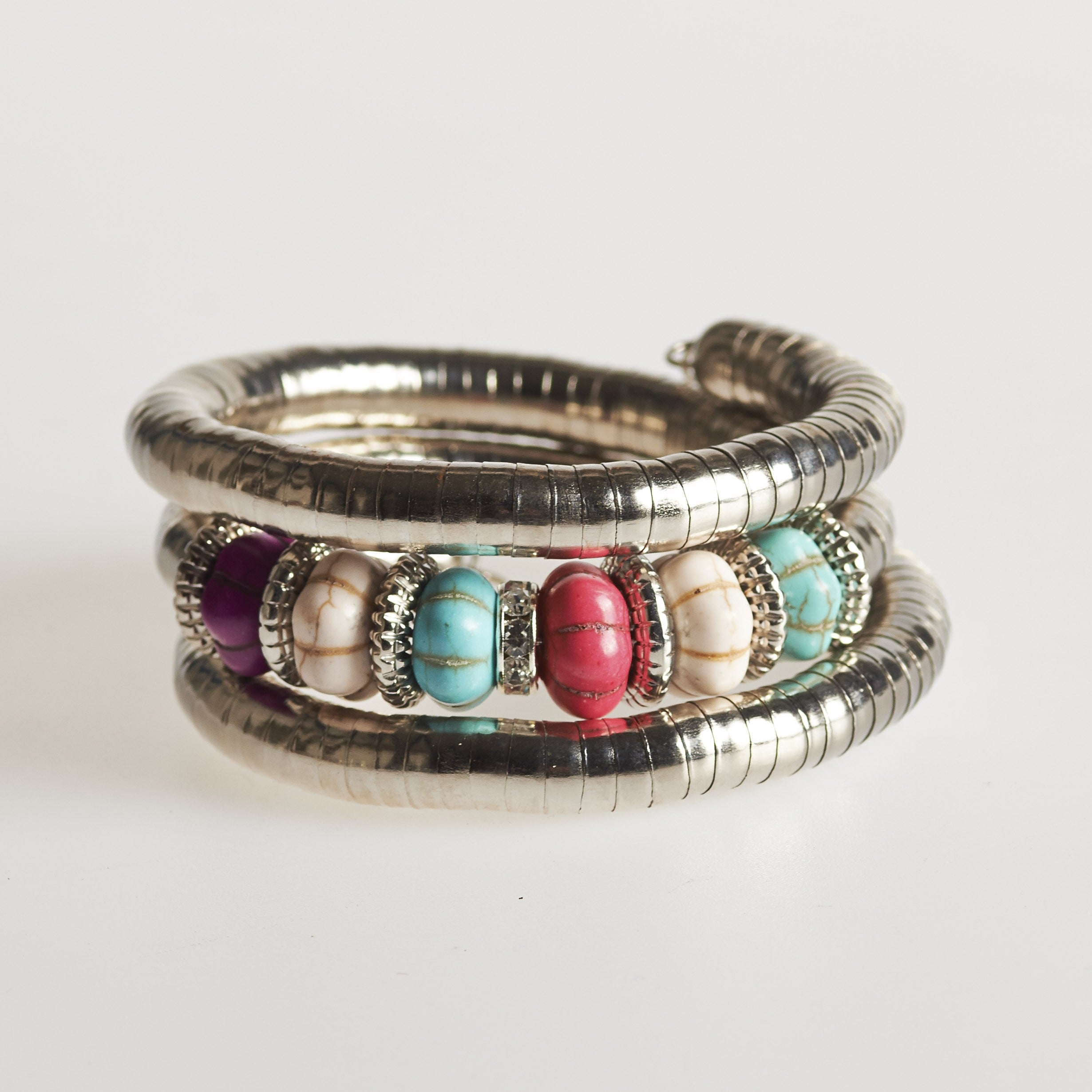 Pulsera espiral plateada - piedrecitas varios colores